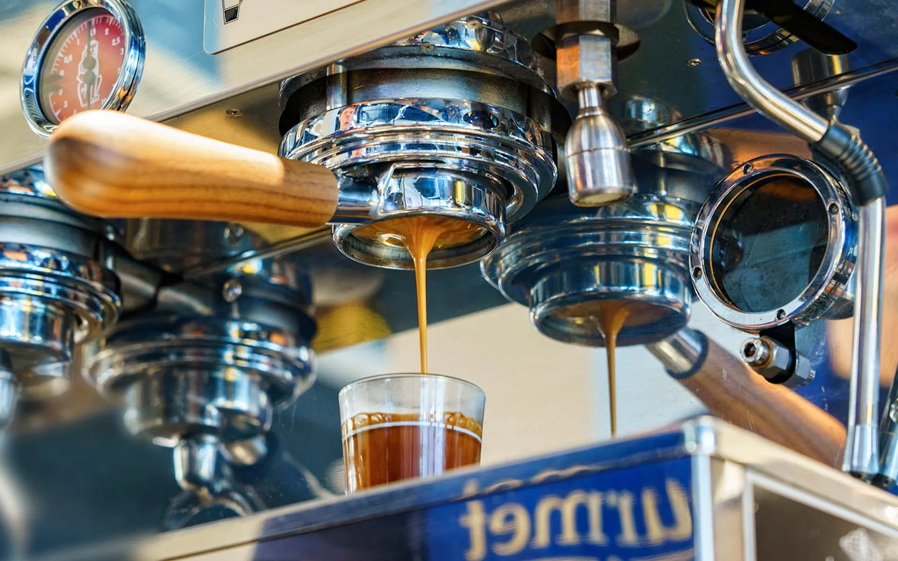 Espresso pouring from a machine into a glass
